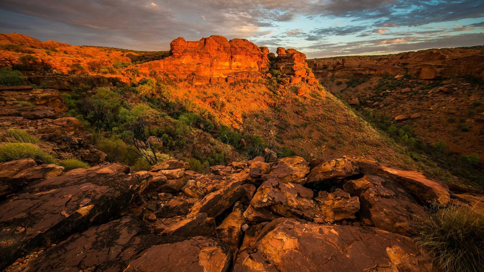 A red desert canyon glowing at sunset (stock photo)