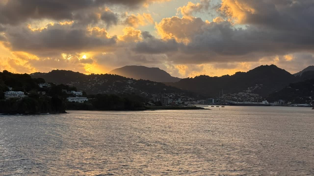 Sunset over a Caribbean island from the water