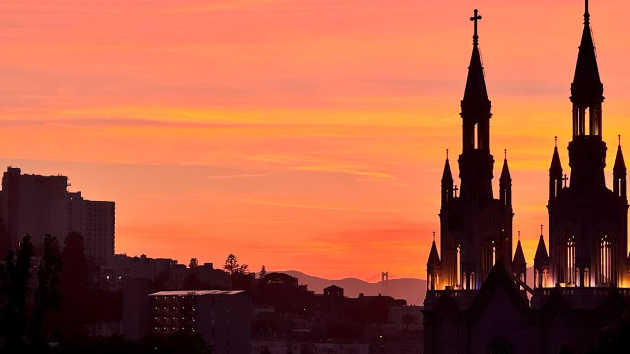North Beach church spires against a sunset sky